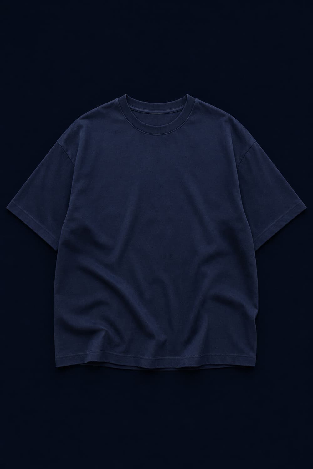 Studio Tee Loose laid flat with soft drape